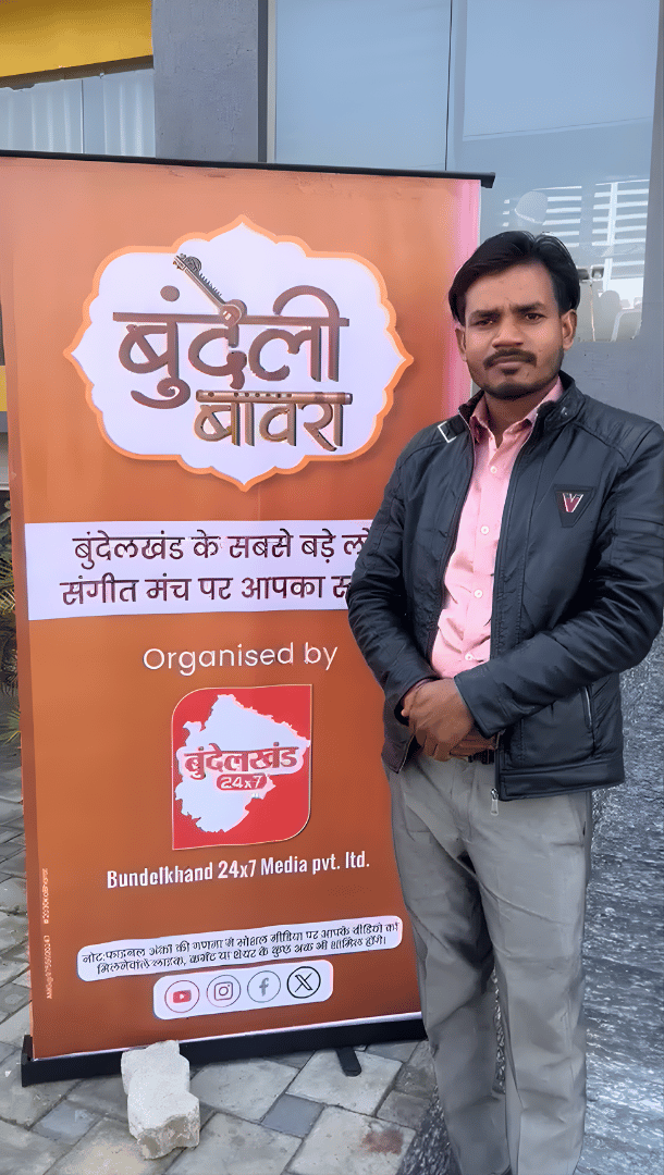 Participant posing at a Bundeli Bawra cultural event venue