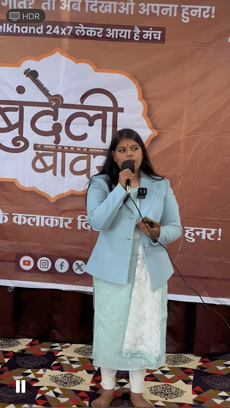Participant addressing the audience during a Bundeli Bawra cultural programme