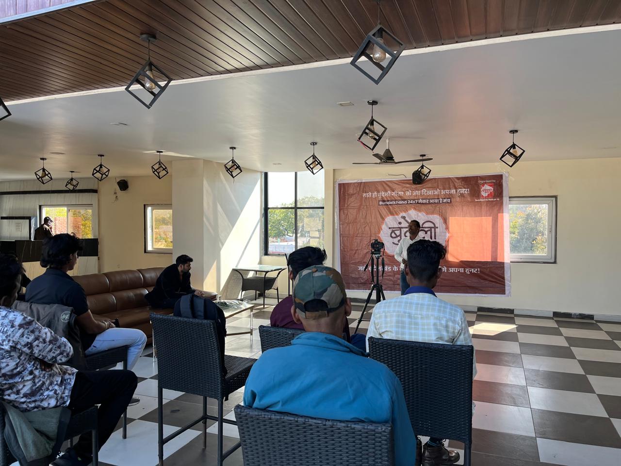Participants attending an indoor Bundeli Bawra cultural session